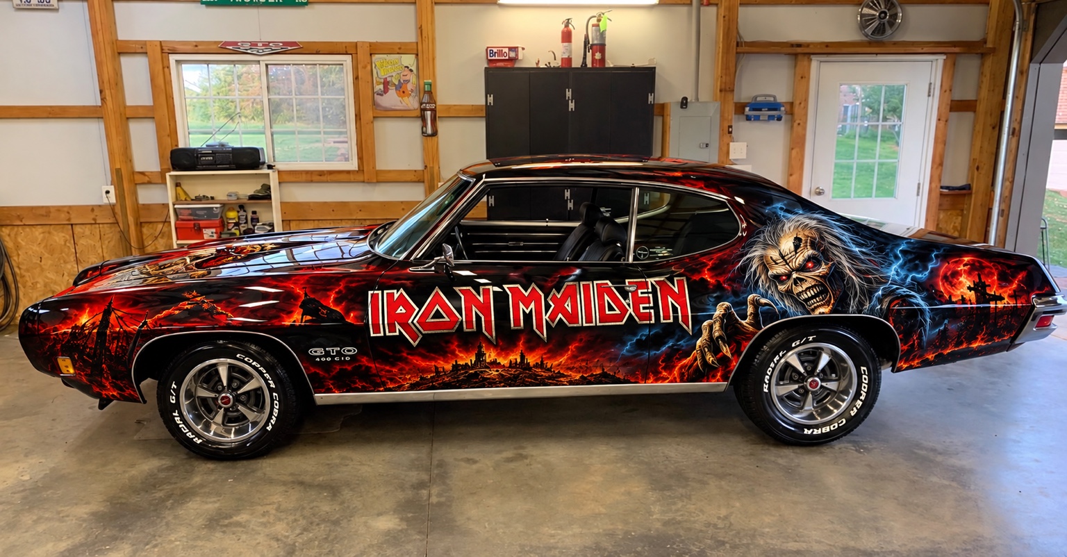 The supplied black-painted hotrod image with red and blue Iron Maiden artwork, shown in a garage.